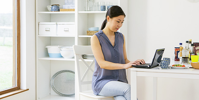 Woman Shops For A Personal Choice EPO Catastrophic Plan On Her Computer