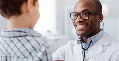 Young Boy Visits Doctor A Part Of Clinical Care Transformation