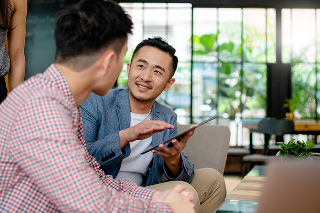 Two associates discussing an assignment