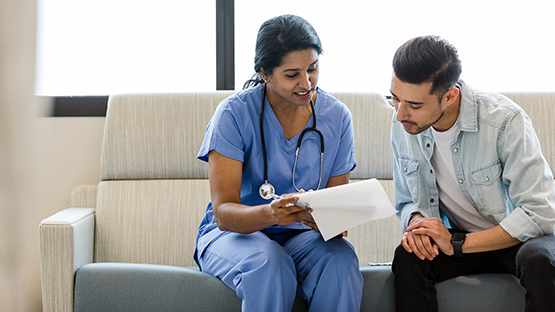 Patient filling out paperwork in doctor's office